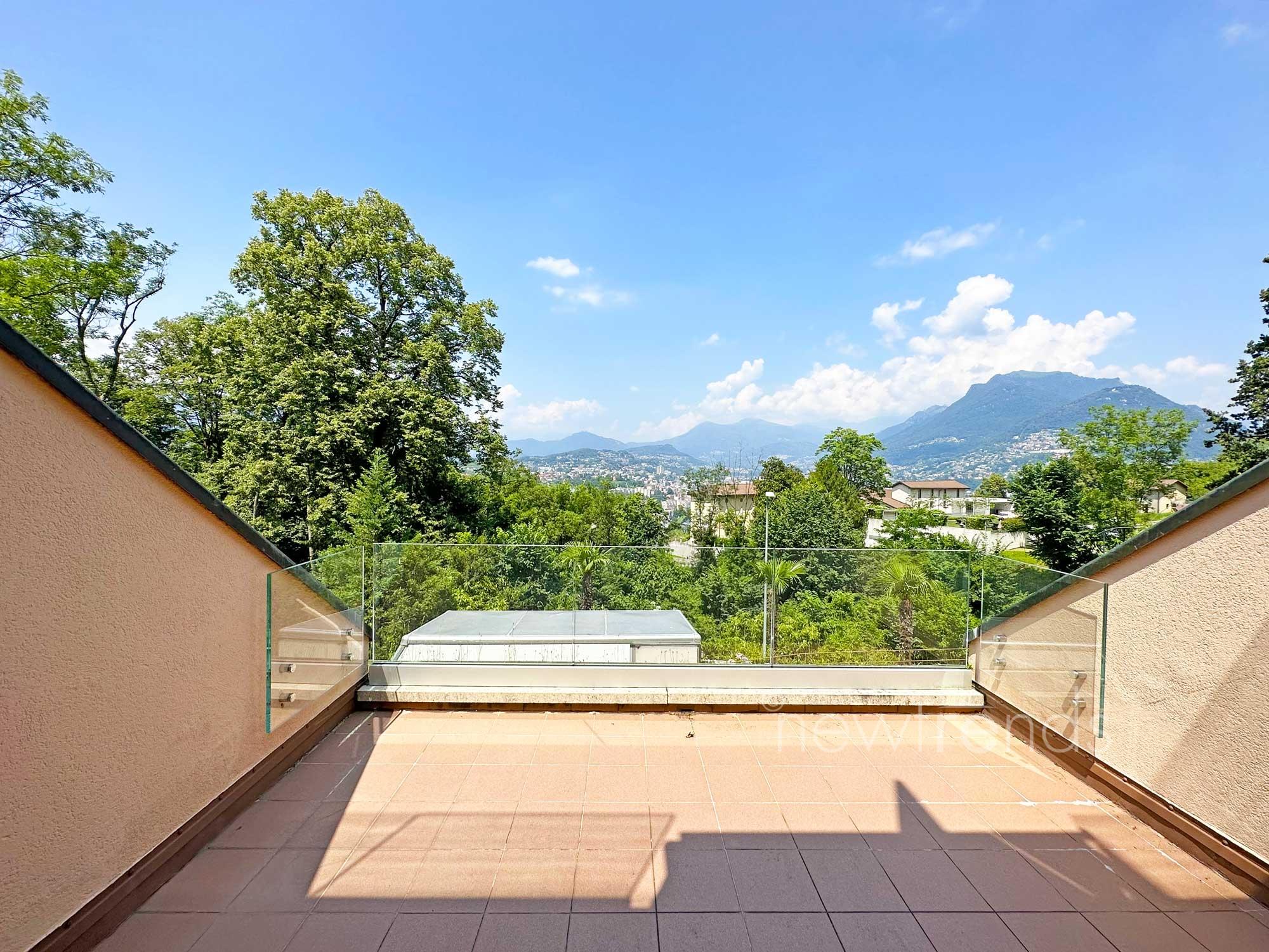 affittasi appartamento 3.5 locali con vista nel verde e scorcio di lago a pazzallo: foto vista da terrazza condominiale